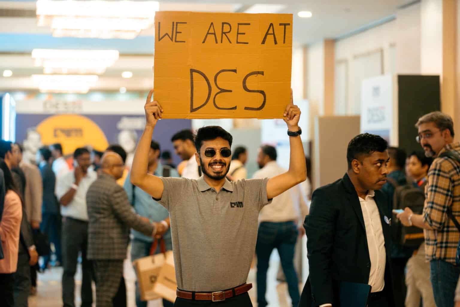 Attendee holding a sign at Data Engineering Summit 2026 event.